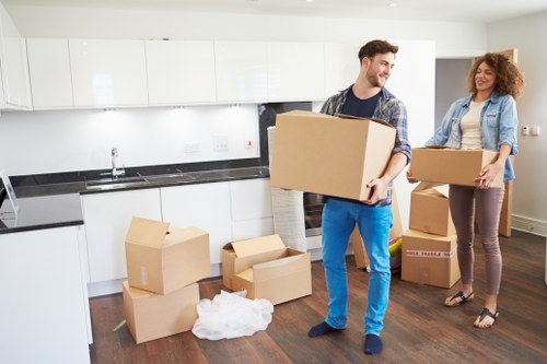 Loading household furniture into a moving truck in Lambeth