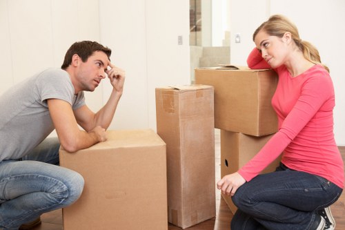 Staff using careful lifting techniques during a removals job